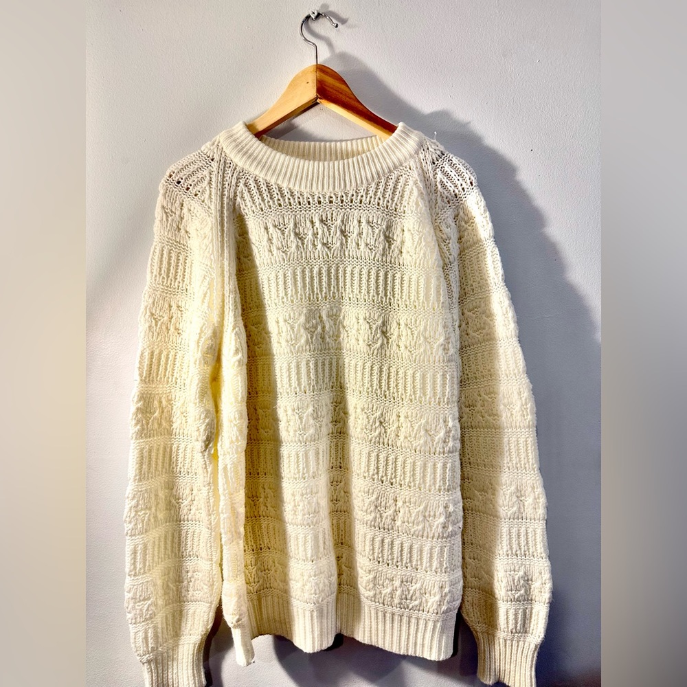 Knitted Ivory sweater.